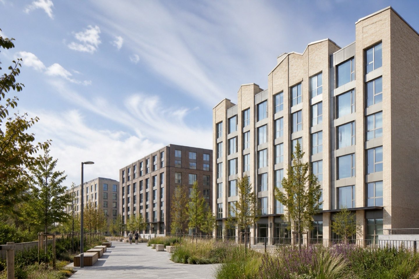 Brick student accommodation buildings along a landscaped street